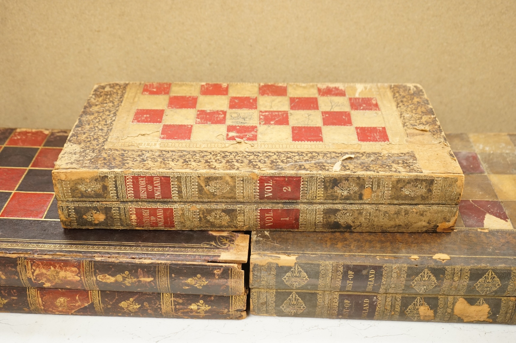 Three folding chess and backgammon boards in the form of books, 42cm